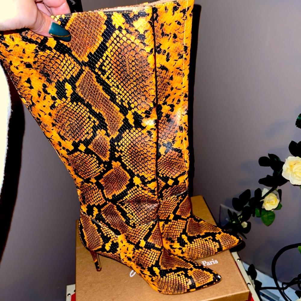 Sexy python knee high pull on boot with stiletto heel size 10. Steve Madden